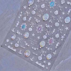 Detailed view of MS630 holographic marine nail stickers with seahorse and seashell designs