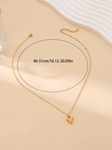 Detail of gold stainless steel heart necklace with length scale from 46 to 51 cm