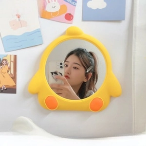 Close-up of a cartoon yellow wall-mounted decorative mirror for student dormitory