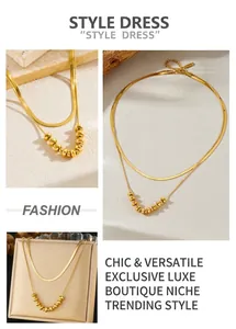 Detail of 18K gold plated stainless steel layered snake and beaded chain necklace