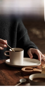 Close-up of ceramic coffee cup with matte glaze and dark rim during use