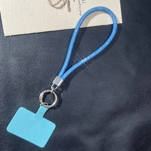 Blue glitter woven phone lanyard strap with silver metal ring and PVC connector tab