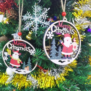 Close-up of wooden Merry Christmas hanging tags with reindeer and snowflake cutouts
