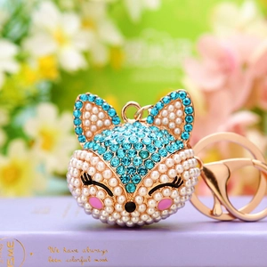 Sparkling fox keychain with blue rhinestones and pearls on a gold metal link