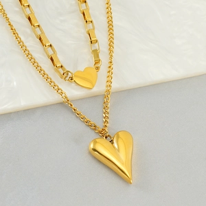 Collier double épaisseur en or avec pendentif cœur, grosse maille et chaîne fine