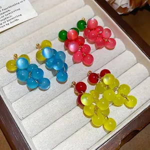 Summer grape cluster bead earrings in pink, blue, and yellow with opalescent finish