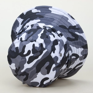 Detail of camouflage bucket hat featuring adjustable wind rope with SPORT lettering