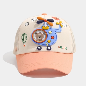 Detail of child baseball cap featuring a 3D helicopter toy and mesh sun protection