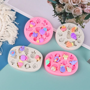 Macro view of silicone molds featuring pineapple, cactus, and donut fruit dessert patterns