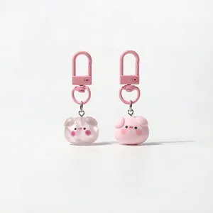Cute pink pig keychains in matte and jelly resin finishes with metal hooks for bags