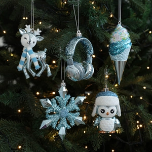 Blue and silver Christmas tree ornaments featuring reindeer and snowflake shapes