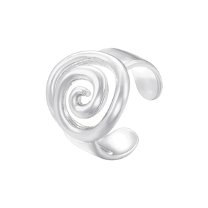 Macro shot of silver metal ear cuff featuring an elegant irregular swirl design