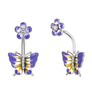 Macro detail of silver navel ring with purple enamel flower and butterfly zircon designs