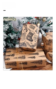 Detail of kraft Christmas gift wrap with pine branch patterns and festive twine ribbon