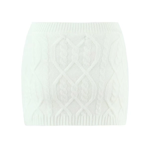 Detail of white cable knit mini skirt showing intricate textured knitting patterns