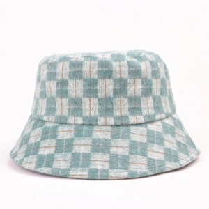 Close-up of green and orange checkerboard wool bucket hat texture and knit detail