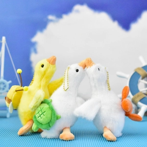 Group of cute plush goose keychains with turtle and bee accessories