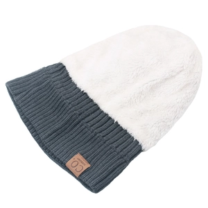 Detail of winter beanie featuring plush white faux fur and grey ribbed knit with leather patch