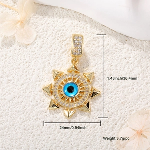 Detail of gold sun Evil Eye pendant with blue center and dimensions 36.4mm by 24mm