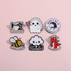 Set of 6 creative enamel pins featuring cartoon ghost, bee, and dinosaur on pink background