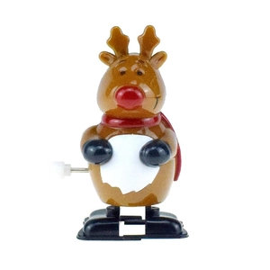 Close-up of a brown clockwork reindeer toy with a red nose and scarf on white background