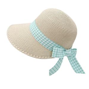 Summer straw sun hat with wide brim and green houndstooth ribbon bow for beach sun protection