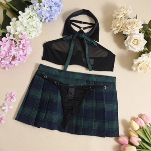 Detailed flat lay of a 3-piece schoolgirl lingerie set with green plaid pleated skirt