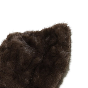 Close-up of thick dark brown faux fur texture with soft and fluffy winter warmth detail
