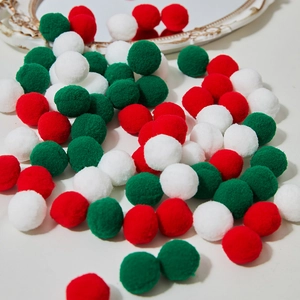 Christmas DIY set with red, white and green plush pompoms for festive decorations