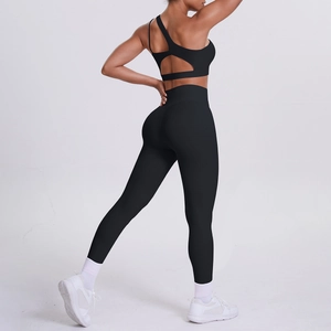 Back view of black one-shoulder sports bra and high-waist leggings set for yoga