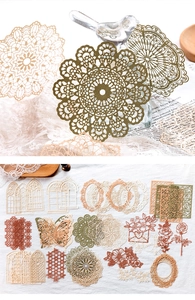 Detailed macro view of vintage lace hollowed-out paper designs for scrapbook decorating