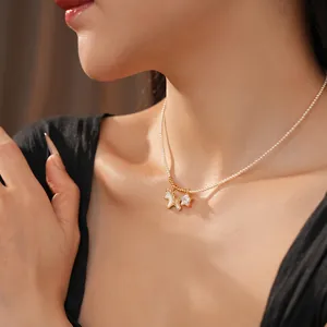 Adjustable pearl necklace with golden unicorn and sparkling star pendant on a female model