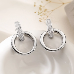 Elegant 18K gold plated silver drop earrings with geometric zircons on white plate