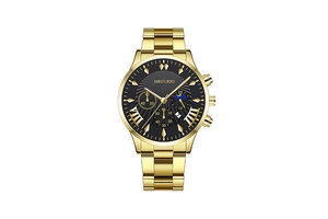 Macro view of gold stainless steel watch dial with three sub-dials and date window
