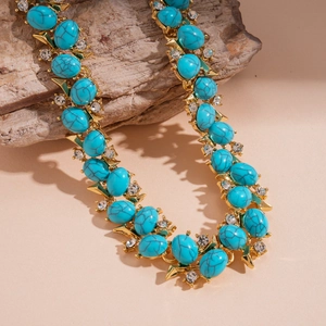 Vintage gold layered necklace with turquoise resin beads and sparkling zircon accents