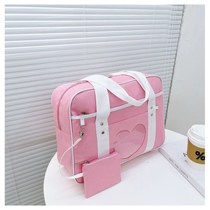 Pink JK uniform bag with a heart-shaped clear window and a small matching pouch