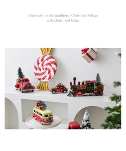 Detailed view of vintage metal Christmas truck and train ornaments on a display shelf