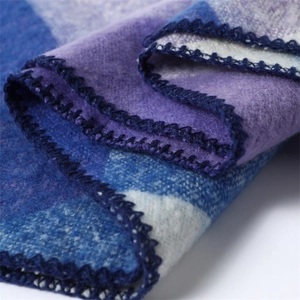 Macro shot of soft blue and purple checkered pashmina with detailed lockstitch edge