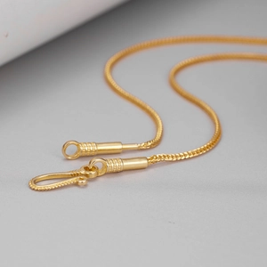 Elegant gold keel chain necklace with spiral clasp fastener on light grey background