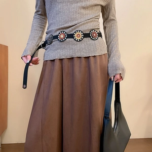 Retro ethnic leather belt with colorful patchwork floral studs on a knit outfit