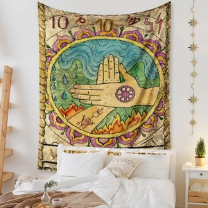 Detail of bohemian tapestry with mystic palmistry and astrology symbols in a cozy bedroom
