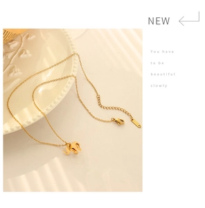 Detailed macro of 18K gold plated elephant pendant with lobster clasp on O-chain