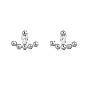 Detailed view of silver curved bead ear jackets with high-polished metallic spheres