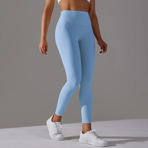 Detail shot of light blue high-waisted yoga leggings showing seamless stretch fabric texture