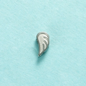 Detailed macro view of silver angel wing pendant crafted in polished stainless steel