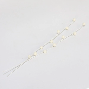 Macro view of cream white artificial berry stems with realistic texture for DIY crafts