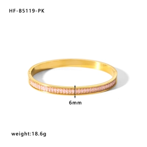 Detail of 6mm gold bangle with pink rectangular-cut cubic zirconia and hinge clasp