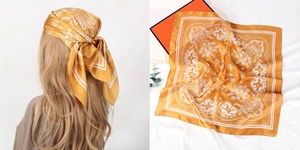 Detailed view of yellow paisley satin scarf shown as a headband and flat lay with box