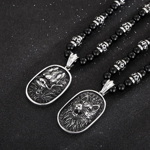 Punk style wolf head pendant necklace with black agate beads and silver dragon tag detail
