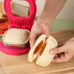 Pink DIY sandwich cutter and sealer tool for making pocket crustless sandwiches at home